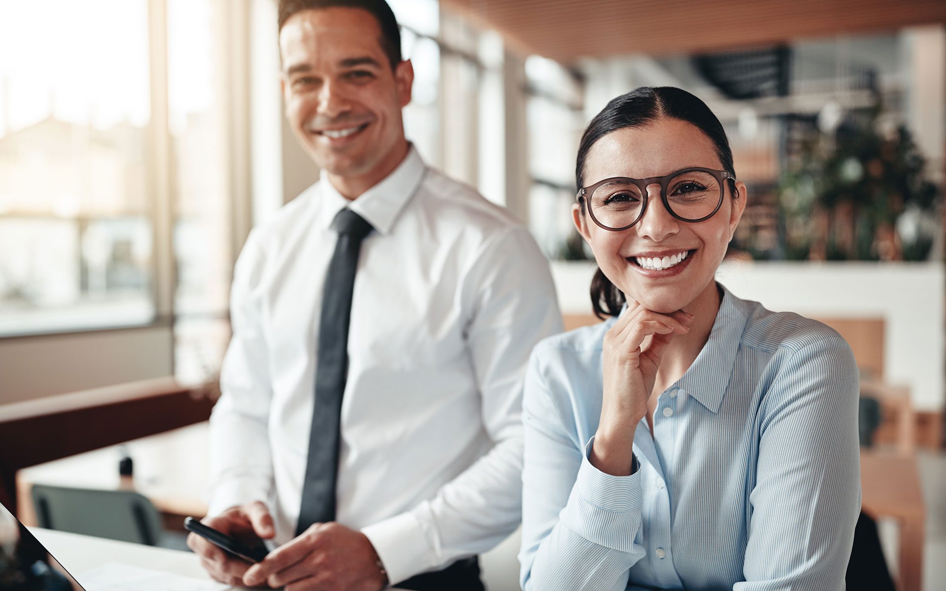 About Us - Woman and Man Business Employees in Modern Office Smiling